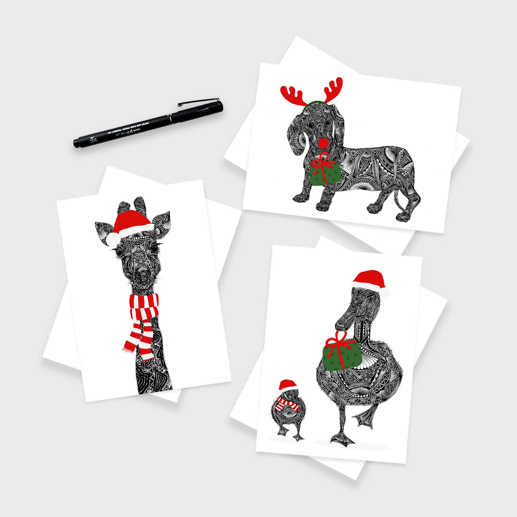 Set of Christmas-themed greeting cards with animals wearing hats and scarves on a white background.