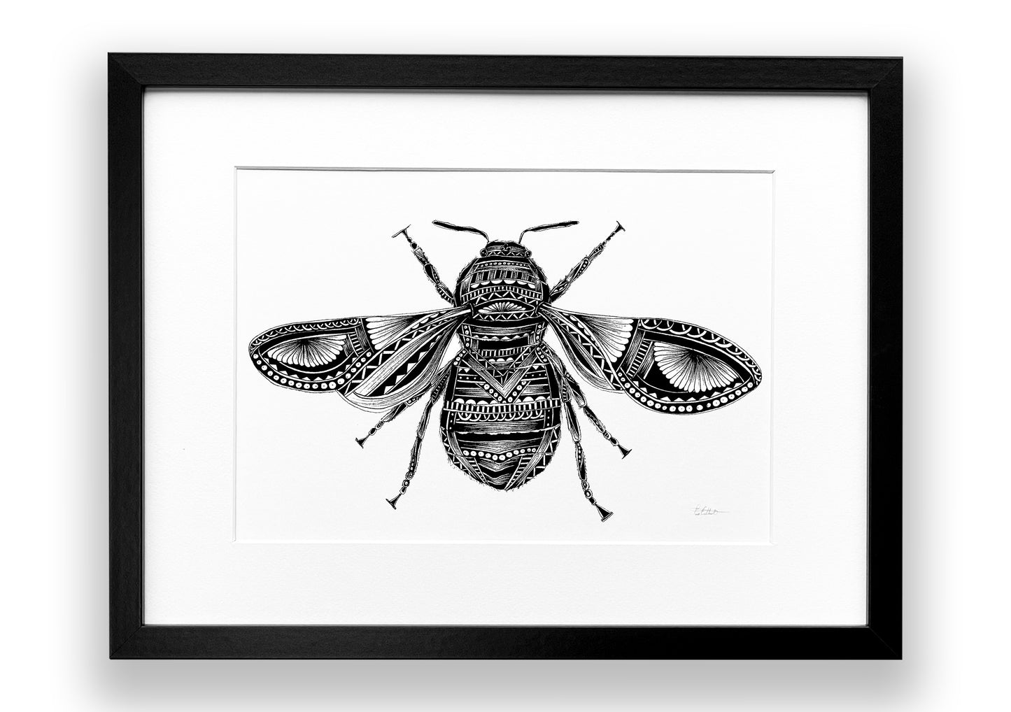 Framed artwork of a detailed black and white bee illustration on a white background