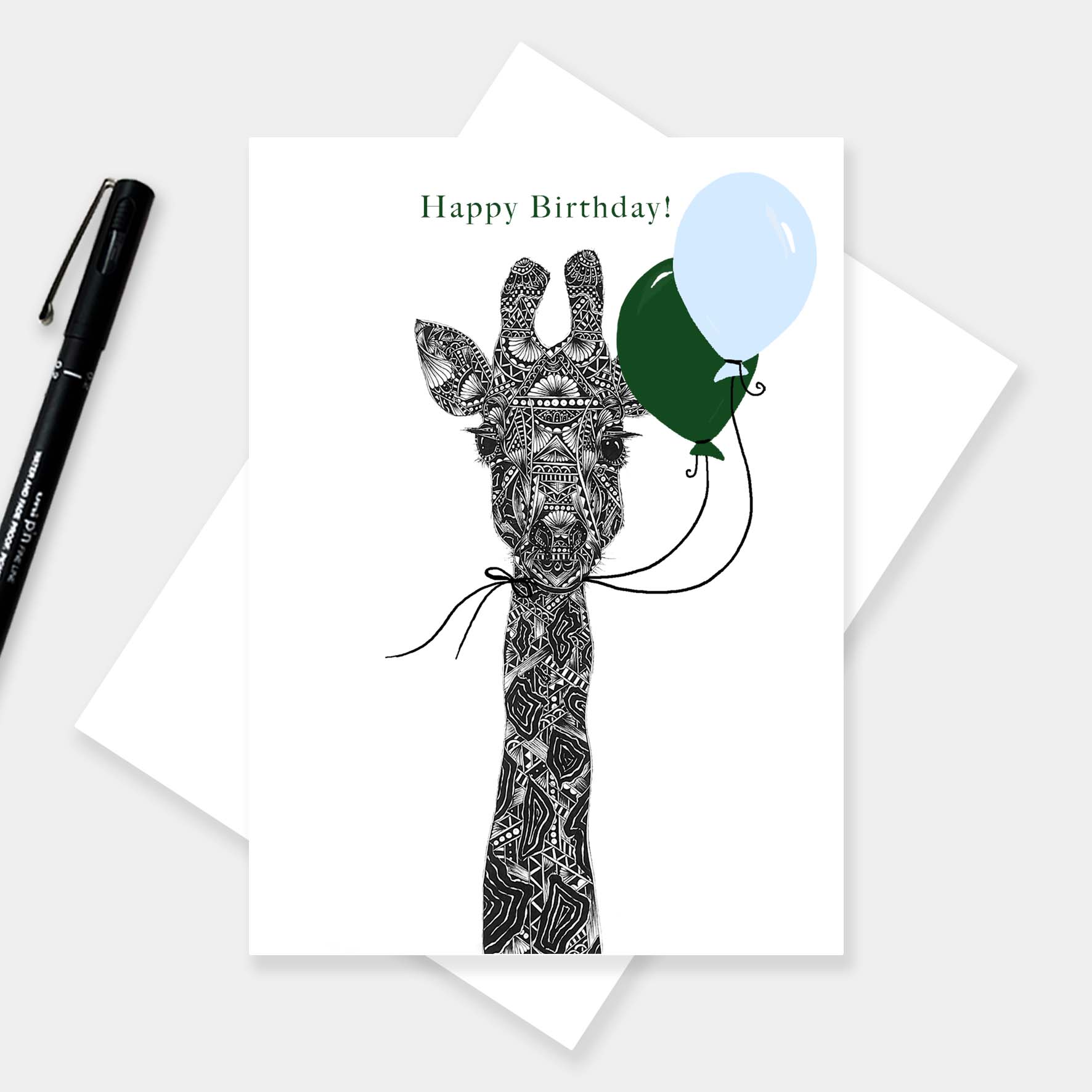 Whimsical giraffe birthday greetings card originally hand drawn in pen and ink by Pia Elliot in her Dorset studio