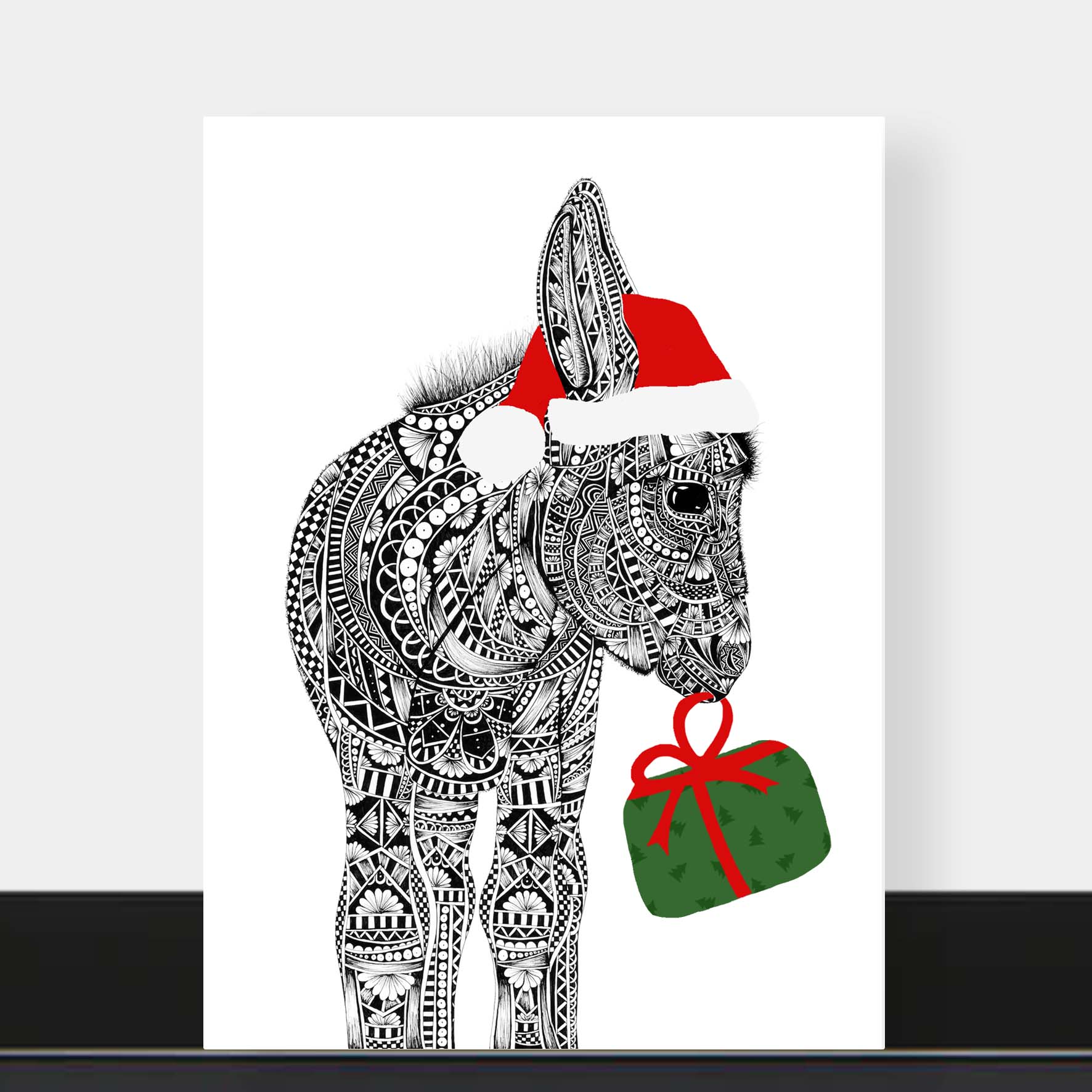 Decorative print of a donkey wearing a Santa hat with a gift, on a white background.
