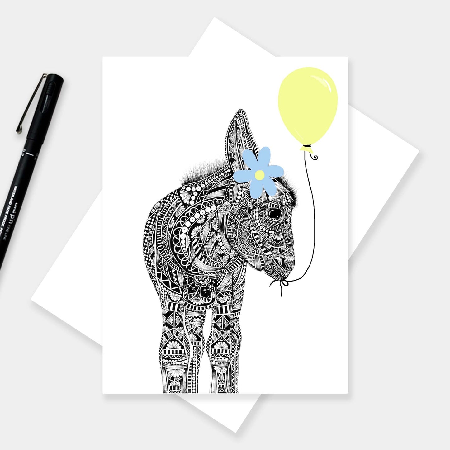 Cute donkey and balloon birthday card originally hand drawn in pen and ink by Pia Elliot in her Dorset studio