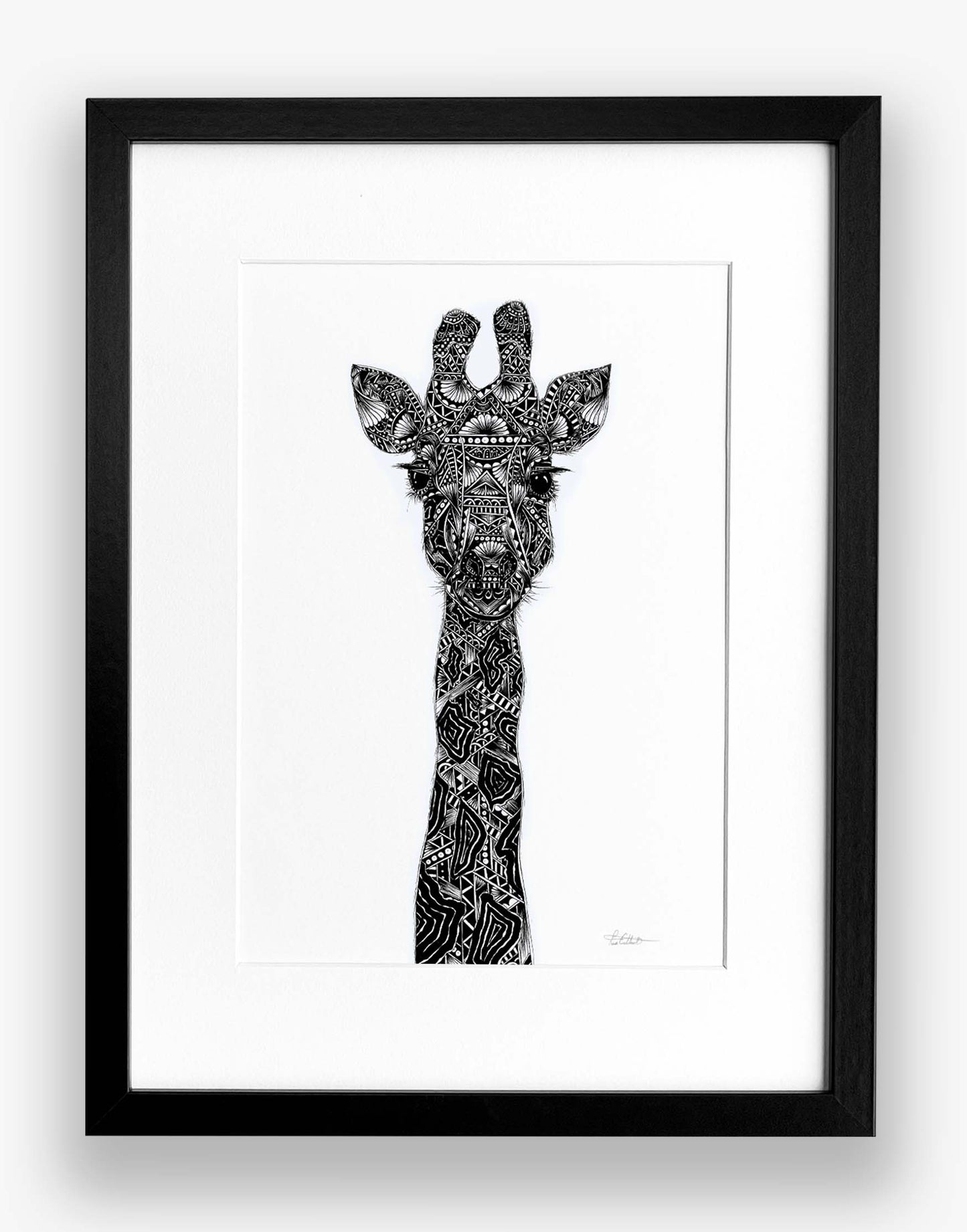 Framed black and white illustration of a giraffe's head on a white background