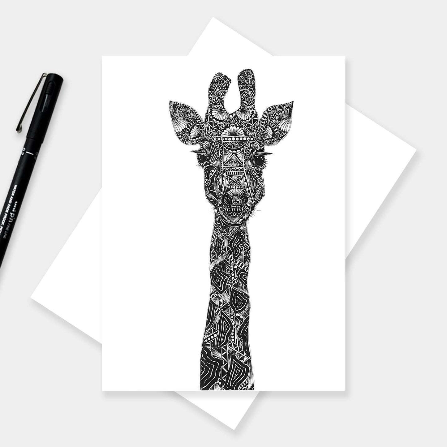 Monochrome blank giraffe greetings card originally hand drawn in pen and ink by Pia Elliot in her Dorset studio
