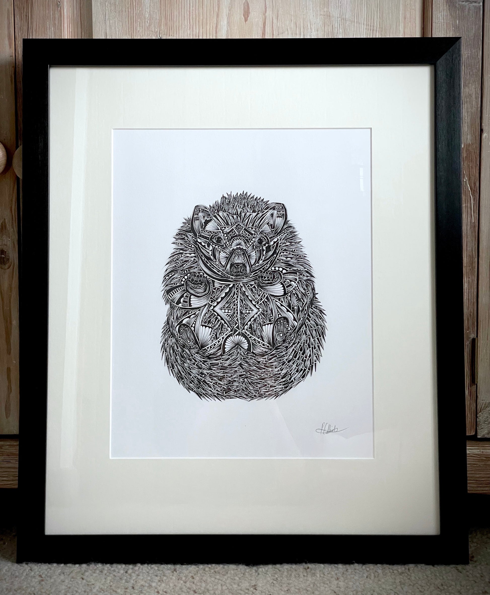 Monochrome hedgehog original artwork in black frame, hand drawn in pen and ink by Pia Elliot in her Dorset studio
