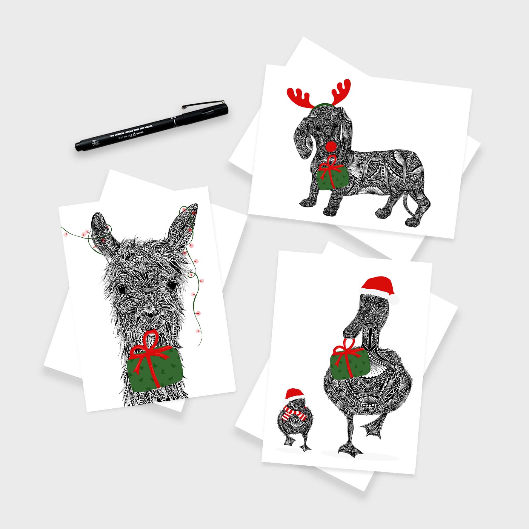 Whimsical animal themed Christmas greetings cards originally hand drawn in pen and ink by Pia Elliot in her Dorset studio