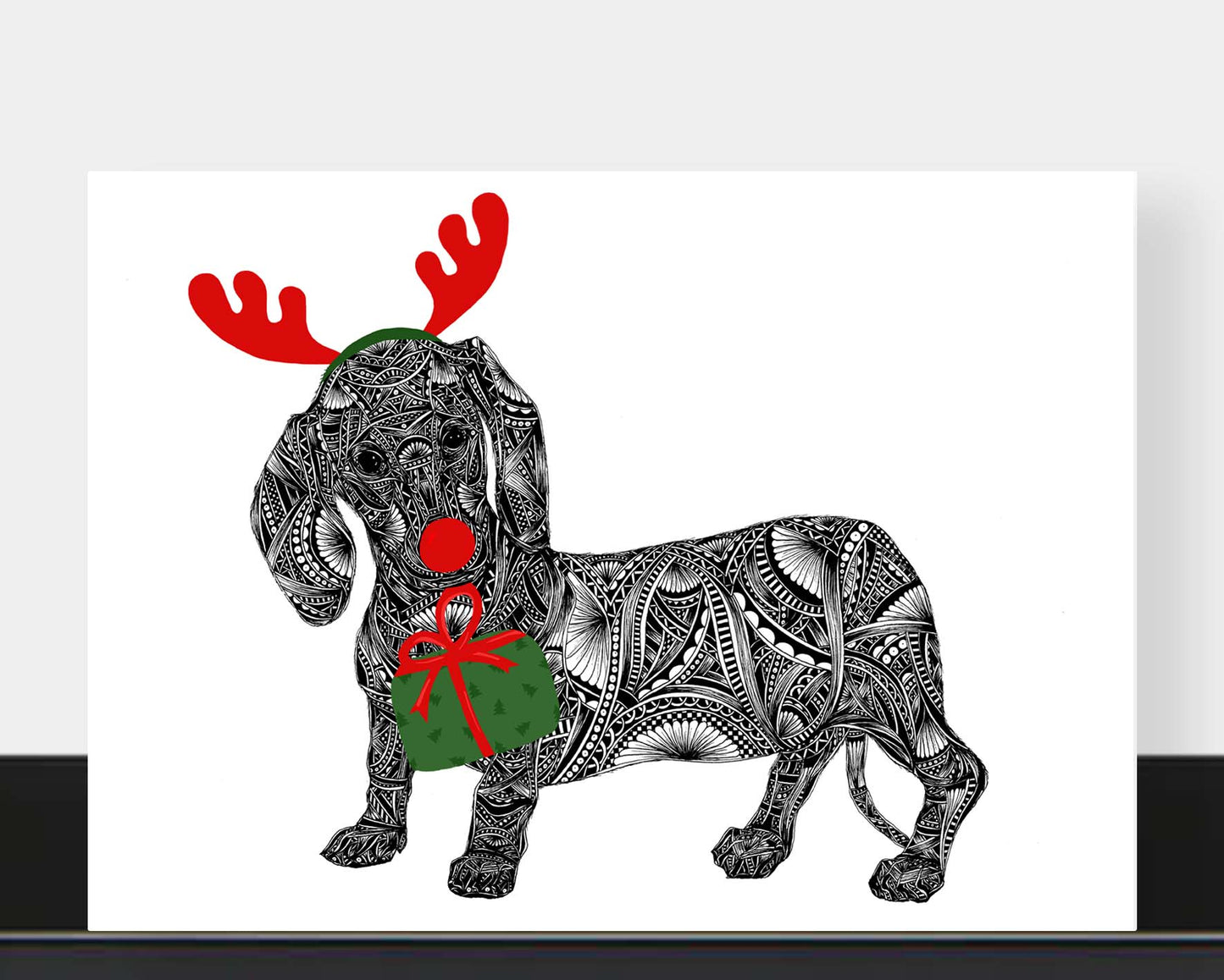 Whimsical sausage dog Christmas greetings card originally hand drawn in pen and ink by Pia Elliot in her Dorset studio