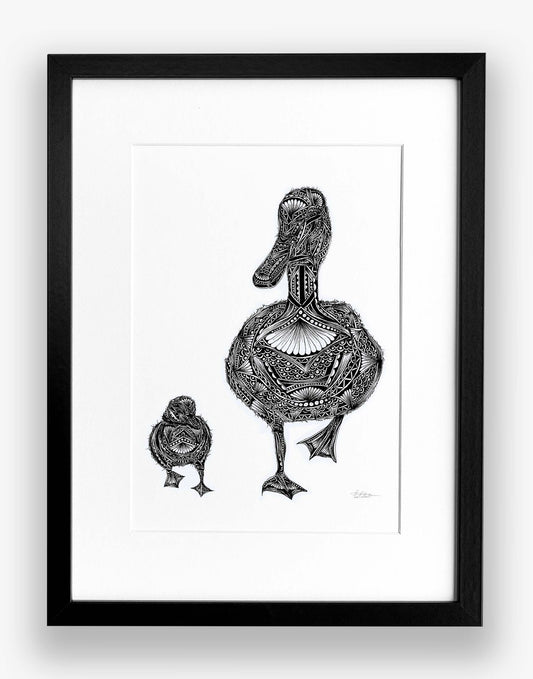 Framed black and white illustration of a stylized duck and chick on a white background